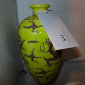 A Chinese porcelain vase decorated with dragons on a yellow field