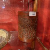 A Chinese bamboo brush pot with landscapes and figures in relief