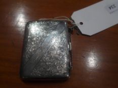 A hallmarked silver ladies purse with foliate engraved engraved decoration and on a silver chain