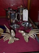A collection of silver plated items including coffee pots, a jug, sucrier and two models of birds