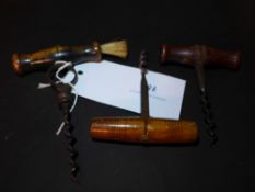 Three corkscrews including a John Watts example a Woolverson with brush and one other