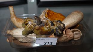 A small quantity  of clay pipes and similar items