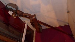An antique sword with leather sheath