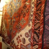 A fine North West Persian Zanjan rug 200 x 115 cm central jade geometrical medallion on a terracotta