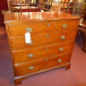 A Georgian mahogany fiddleback chest fitted four long drawers on bracket feet