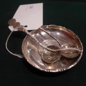 A C19th Chinese Guan Xu period sterling silver coin dish together with a pair of Tong Zhi silver