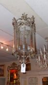 A chrome and glazed cylindrical form hanging lantern
