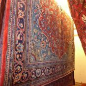 A fine North West Persian Sarouk rug 215 x 140 cm central pendant medallion on a terracotta field