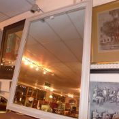 A wall mirror with rectangular plate in grey painted frame