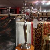 A pair of silver plated five branch candelabra