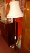 An oak standard lamp with shade