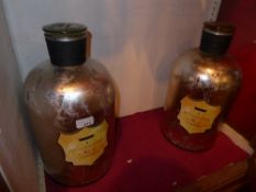 A pair of oversized model apothercary jars