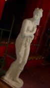 A stone ware garden statue of a maiden
