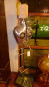 A contemporary designer sculptural valet in stainless steel and aluminium