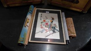 A glazed and framed Chinese embroided silk together with some Chinese scrolls