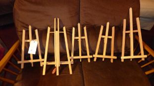 A collection of five maple easels