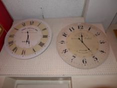 Two circular wall clocks with Roman numeral dials