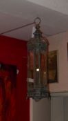 A pagoda form metal and glazed hanging lantern