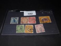 Seven Chinese stamps decorated with dragons