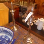 A set of four silver plated table lamps