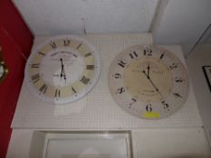 Two circular wall clocks with Roman numeral dials