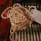 A collection of pearl necklaces and similar