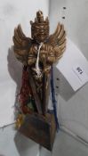 A Tibetan bronze deity figurine with silk cloak
