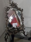 A Continental 900 silver framed Rococo design mirror (A/F)