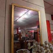 A C19th wall mirror the rectangular plate within giltwood frame