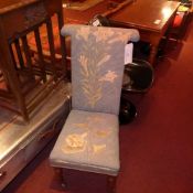 A William IV rosewood prie dieu upholstered in tapestry fabric decorated with lillies
