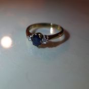 A gold diamond and sapphire ring hallmarks slightly rubbed