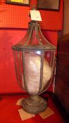 A painted distressed finish lantern with glazed panels