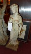 A faux stoneware figure of a maiden