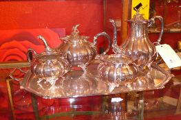 A Sheffield silver plate four piece tea service and a Mappin and Webb silver plated tray
