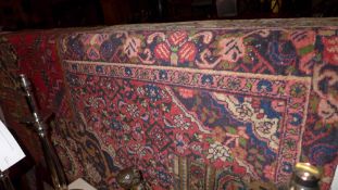 A handmade Persian patchwork carpet