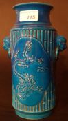 A Chinese blue glazed vase with dragons in relief