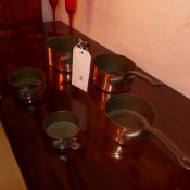 A set of French copper pots of graduating size (5)