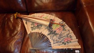 An old Chinese parasol and a similar fan