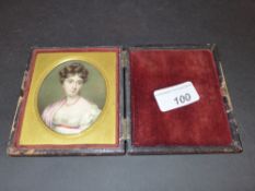 A Regency portrait miniature of a young lady in a gilded surround