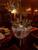 A gilt metal and cut glass basket form chandelier with leafy detail