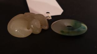 A Chinese jade carving and similar jade pendant