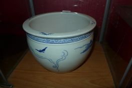 A Chinese blue and white bowl decorated with figures