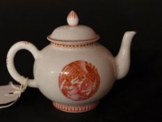 A Chinese white porcelain tea pot decorated with image of a bird