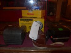 A collection of cameras including an Italian 'Comet' by Bencini of Milan, Kodak items, and two
