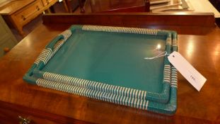 A pair of vintage green trays of graduating size