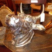 A chromed wall mounting bulls head