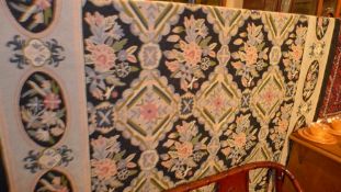 A William Morris style Aubusson needle point tapestry decorated with flowers
