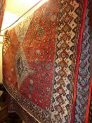 An extremely fine South West Persian Abadeh carpet repeating pole medallion with petal and animal
