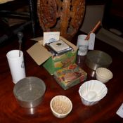 A collection of kitchenalia including jelly moulds a bottling thermometer an Italian pasta machine