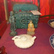 A Chinese earthware green glazed wall pocket together with a crackle glazed teapot a painted resin